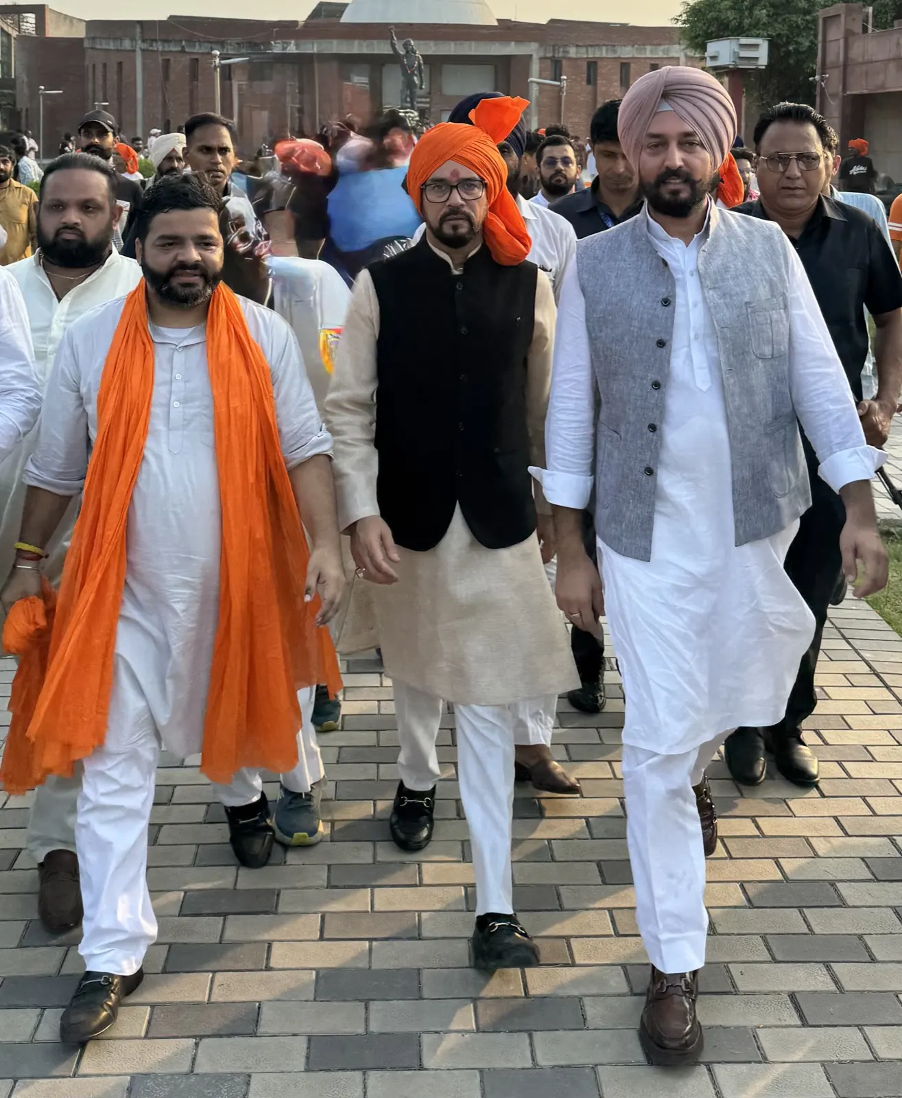 Walking with supporters during a party procession